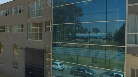 Close-up tilt up shot of the frontal view of a building with aluminum windows Stock Footage 107361900