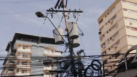Close up tilt shot revealing a cabling mess on an urban street pole, Stock Footage 164269764