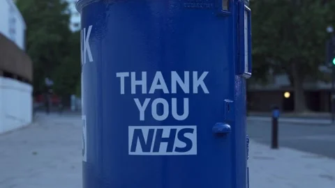 A close up tilt shot of the right side of the Blue Thank you NHS Letter Box Stock Footage 131521021