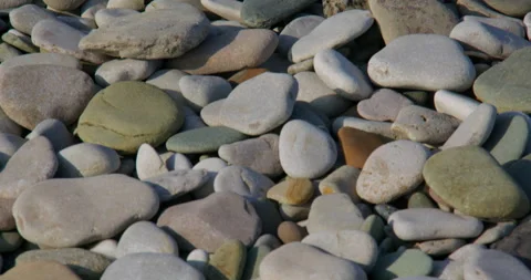 Close-up Tilting shot of Pebbles on the beach at pensarn, north Wales 動画素材 346191190
