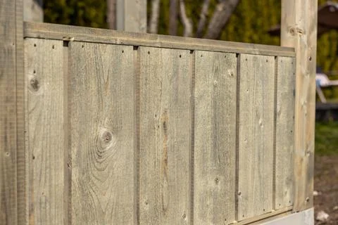 Close up timber cladding on greenhouse frame in afternoon light Stock Photos
