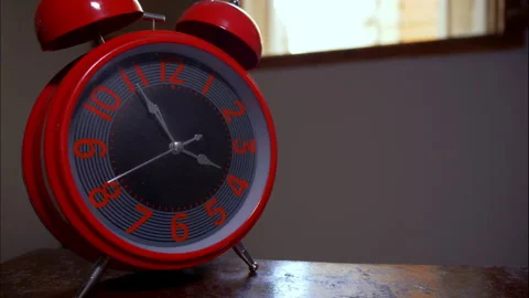 Close-Up Time-Lapse of Big Red Antique Alarm Clock by Open Window Stock Footage 337888621