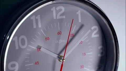 Close-Up Time-Lapse of Gray Circular Clock With Red Numerals and Second Hand Stock Footage 337392943