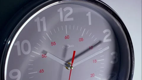 Close-Up Time-Lapse of a Gray Circular Clock With Red Minute Markings Stock Footage 337393574