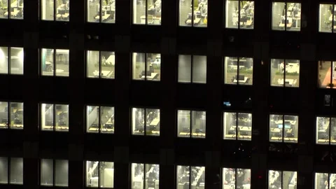 Close up time lapse shot of office building window at night. Видео 337654386
