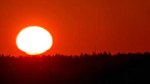 Close-up time-lapse of the sunset over the forest. Stock Footage 145188718