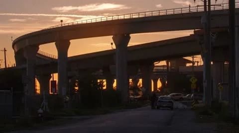 Close Up - Time Lapse of Sunset by the Skytrain bridges in Richmond, BC, Canada Stock Footage 12517909