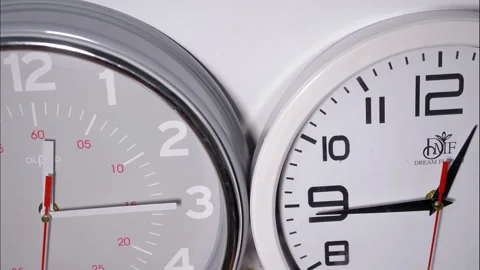 Close-Up Time-Lapse of Two Vintage Clocks Side by Side Stock Footage 337809851