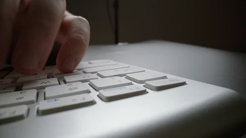 Close-up time lapse typing on keyboard with fingers. Macro soft focus dolly shot Stock Footage 116436745