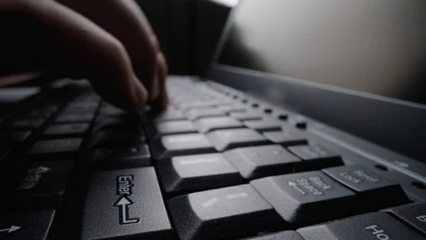 Close-up time lapse typing on keyboard with fingers. Macro soft focus dolly shot Stock Footage 117265500