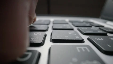 Close-up time lapse typing on keyboard with fingers. Macro soft focus dolly shot Stock Footage 117813760