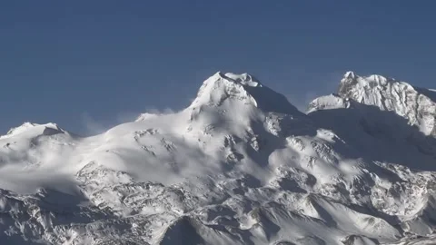 Close up time lapse of wind blowing snow on Himalayan peak Stock Footage 333809578