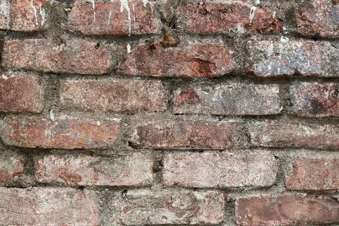 A Close-up of a Time-Worn Red Brick Wall Showing Grit and Texture Stock Photos