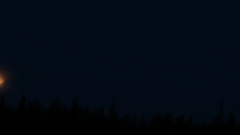 CLOSE UP timelapse video of partial moon eclipse ending phase to reveal Stock Footage 115974740