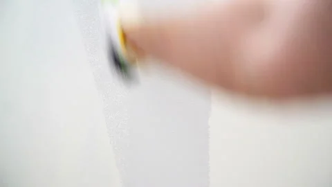 Close-up Timelapse of Worker Painter Paints the Wall with a Roller Stock Footage 125714391