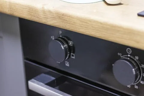 Close up of the timer and mode relays of the oven. Appliance Stock Photos