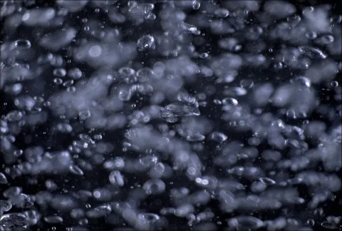 Close-up of tiny bubbles bobbing on a black background Stock Footage 86919604