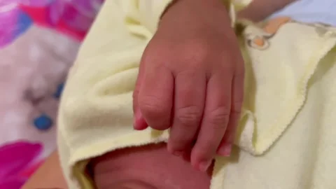 Close up of tiny hand of newborn baby 動画素材 343174946