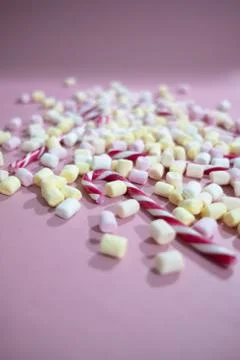 Close-up on tiny marshmallows and Christmas candy canes Stock Photos