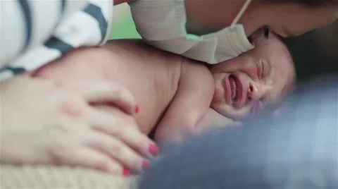 Close up of tiny newborn baby crying desperately.  Stock Footage 50155679