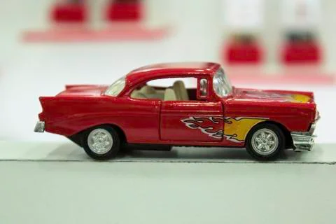 Close up a tiny random red toy hot wheel car Foto stock