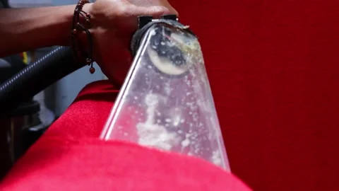 Close Up Tip Head Water Vacuum Dryer With Particles On Wet Washing Red Sofa Stock Footage 161551400
