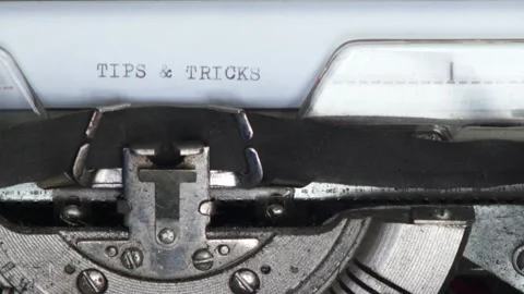Close up TIPS AND TRICKS being typed on vintage typewriter Stock Footage 185127893