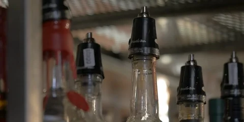 Close-up of the tips of bottles of alcohol at a bar. Stock Footage 114192971