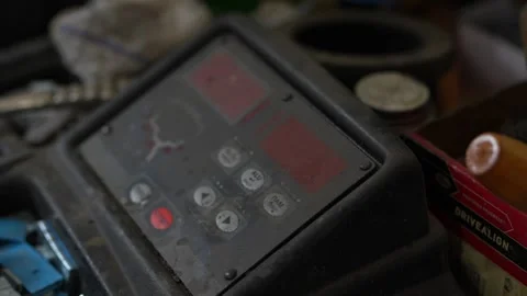 A close-up of a tire balancing machine's digital display. Stock Footage 331941834