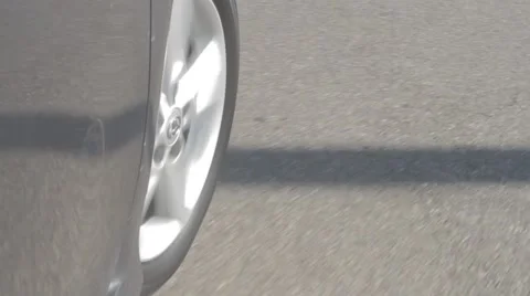 Close up of tire driving from stopped position Stock Footage 52243137