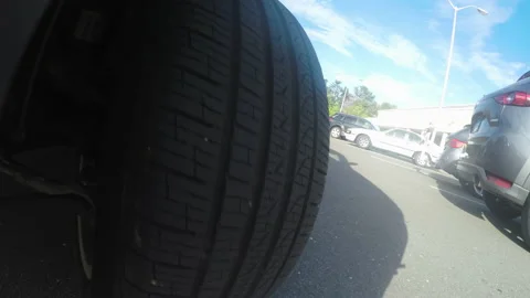 Close-up Tire POV as Car Pulls into Parking Space in Parking Lot Stock-Footage 131253598