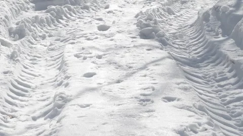 Close-up of tire prints in snow Stock Footage 335646693
