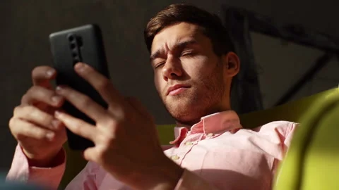 Close up of tired young man having blurry vision is rubbing and squinting eyes Stock Footage 168571188