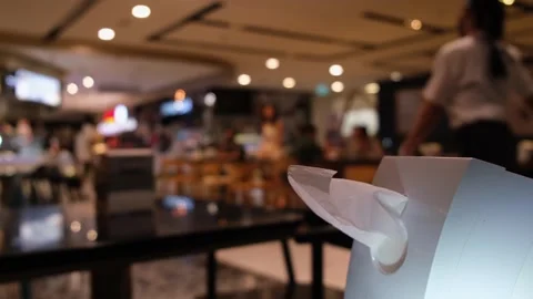 A close-up of a tissue paper tip partly out of a tissue holder, as waiters Stock Footage 255686731