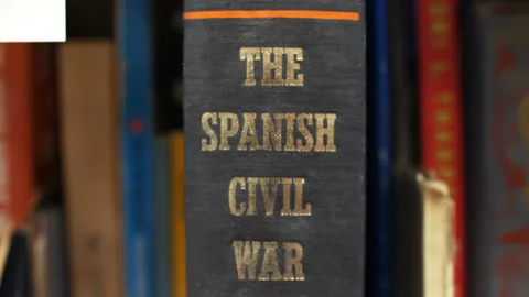 Close up on the title of a cloth bound book - The Spanish Civil War Stock Footage 153123710