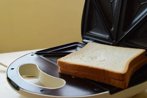 Close-up of toast in a sandwich maker Stock Photos