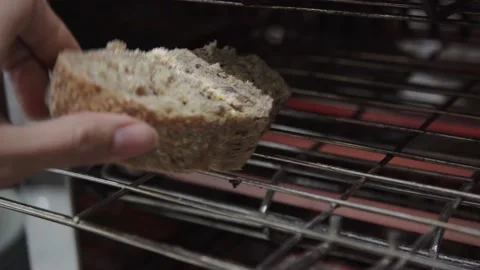 Close up toasting freshly baked bread Stock Footage 153510418
