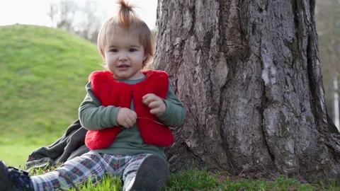 Close Up Toddler Portrait by Tree Trunk in Park Serbia Stock Footage 331127331