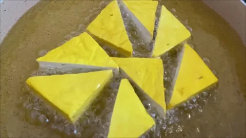 Close Up of Tofu Being Fried in Hot Oil Cooking Footage Stock Footage 310276586