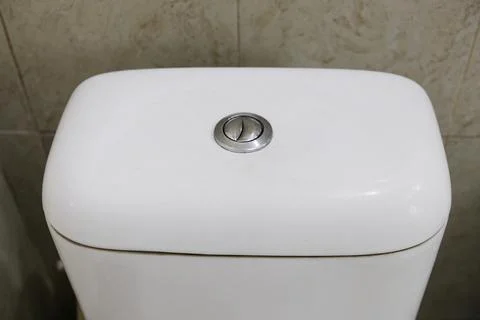 Close-up of toilet flush button Stock Photos