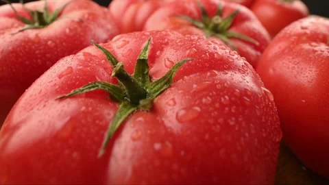 Close-up of a tomato with a drop of water on it. 스톡 동영상 271196700