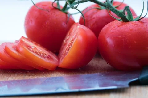 Close up of tomatoes on a cutting board Stock Photos