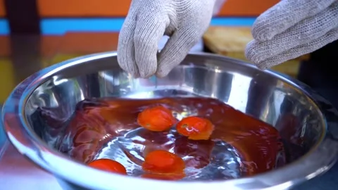 Close up tomatoes falling into the water with a splash and bubbles on background 動画素材 132206087