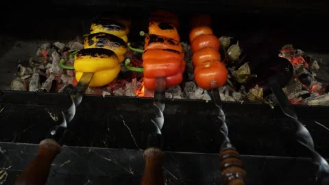 Close-up of tomatoes, peppers and eggplants cooked over charcoal on a grill. Stock Footage 322215352