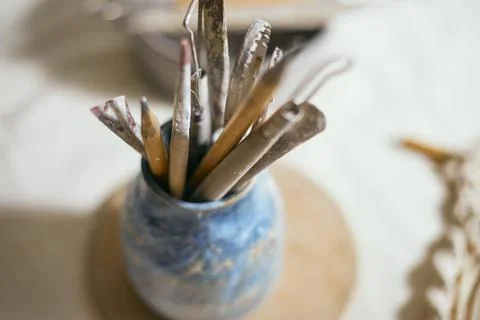 Close up Tools for forming clay on background Stock Photos