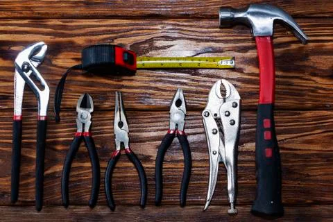 Close up tools on a wooden background. Stock Photos