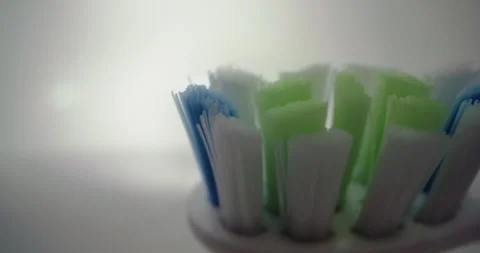 Close-up of a toothbrush with bristles in the bathroom. Stock Footage 249661502