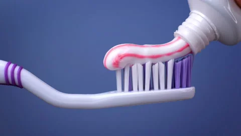 Close-up of a toothbrush with toothpaste on it Stock Footage 168821160