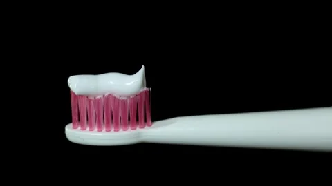 Close-up of toothbrush with toothpaste ready for brushing teeth Stock Footage 340264203
