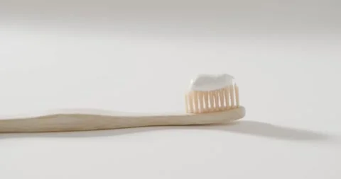 Close up of toothbrush with toothpaste on white background with copy space Stock Footage 331246059